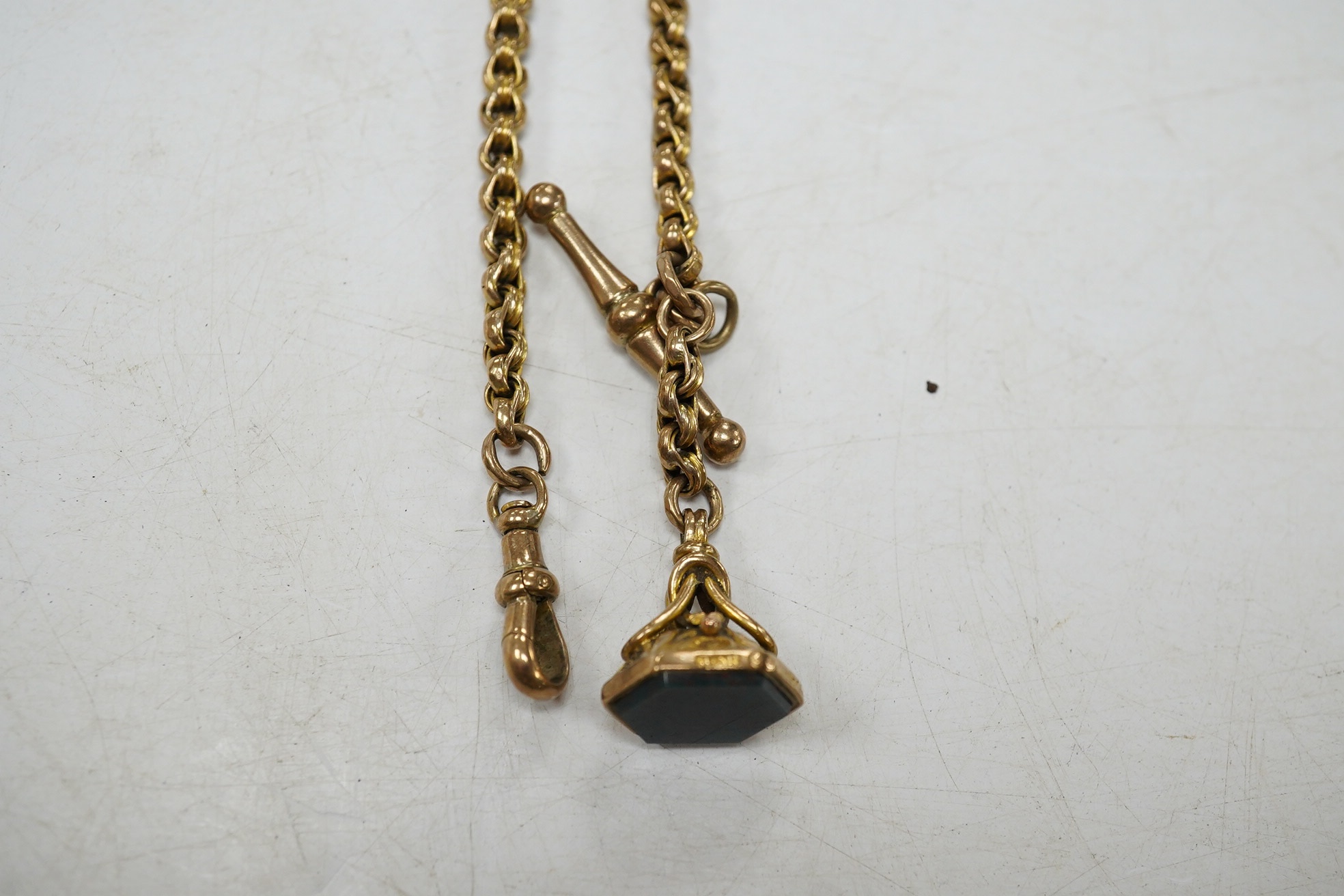 A late Victorian 9ct albert, hung with a late Victorian 9ct gold and bloodstone set fob seal, 23cm, gross weight 12.2 grams. Condition - fair